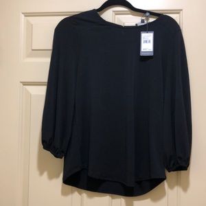 Black knit blouse. New with tags.